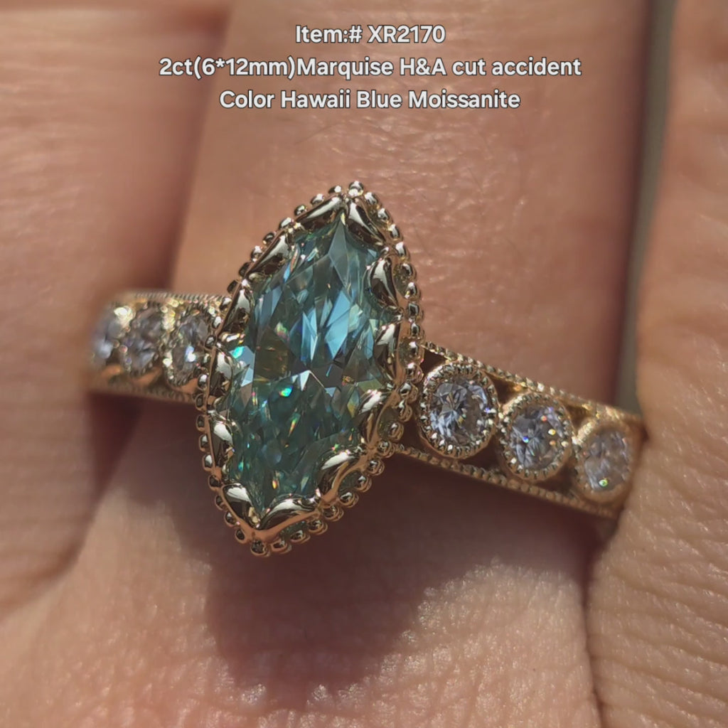DovEggs Marquise Hawaii blue moissanite ring sparkling in sunlight video.