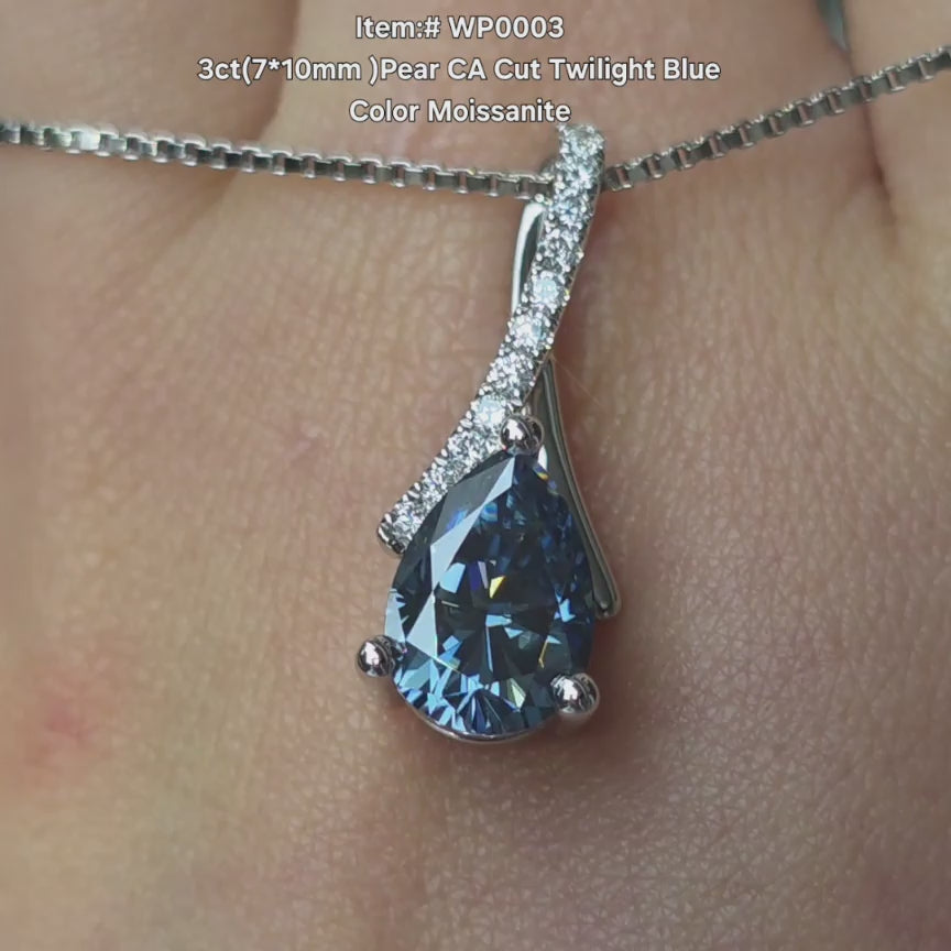  DovEggs CA cut pear twlight blue moissanite necklace sparkling in sunlight video