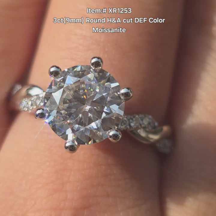 DovEggs 3ct round moissanite engagement ring sparkling in sunlight video.