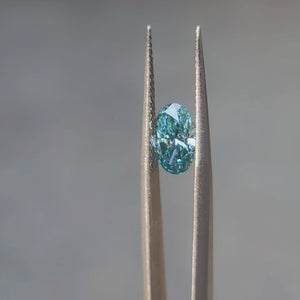 1.539ct oval fancy vivid blue diamond in natural light, showing excellent color distribution
