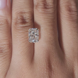 Close-up video of 3.07ct radiant cut diamond under warm indoor lighting, highlighting excellent cut and fire