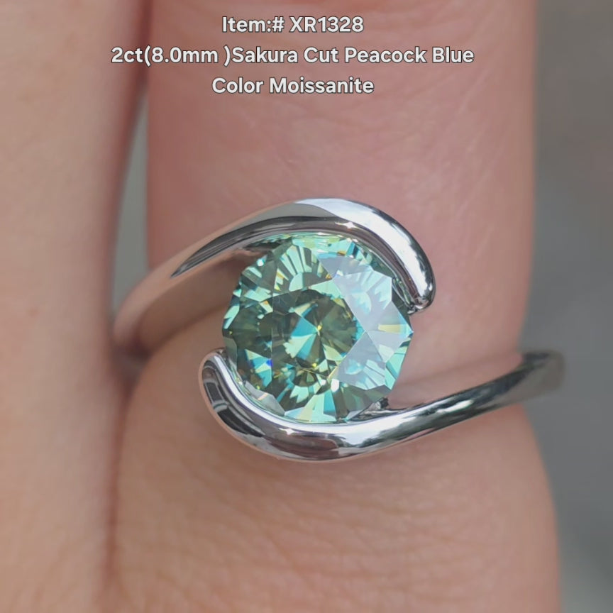 DovEggs sakura cut peacock blue ring sparkling in natural light video