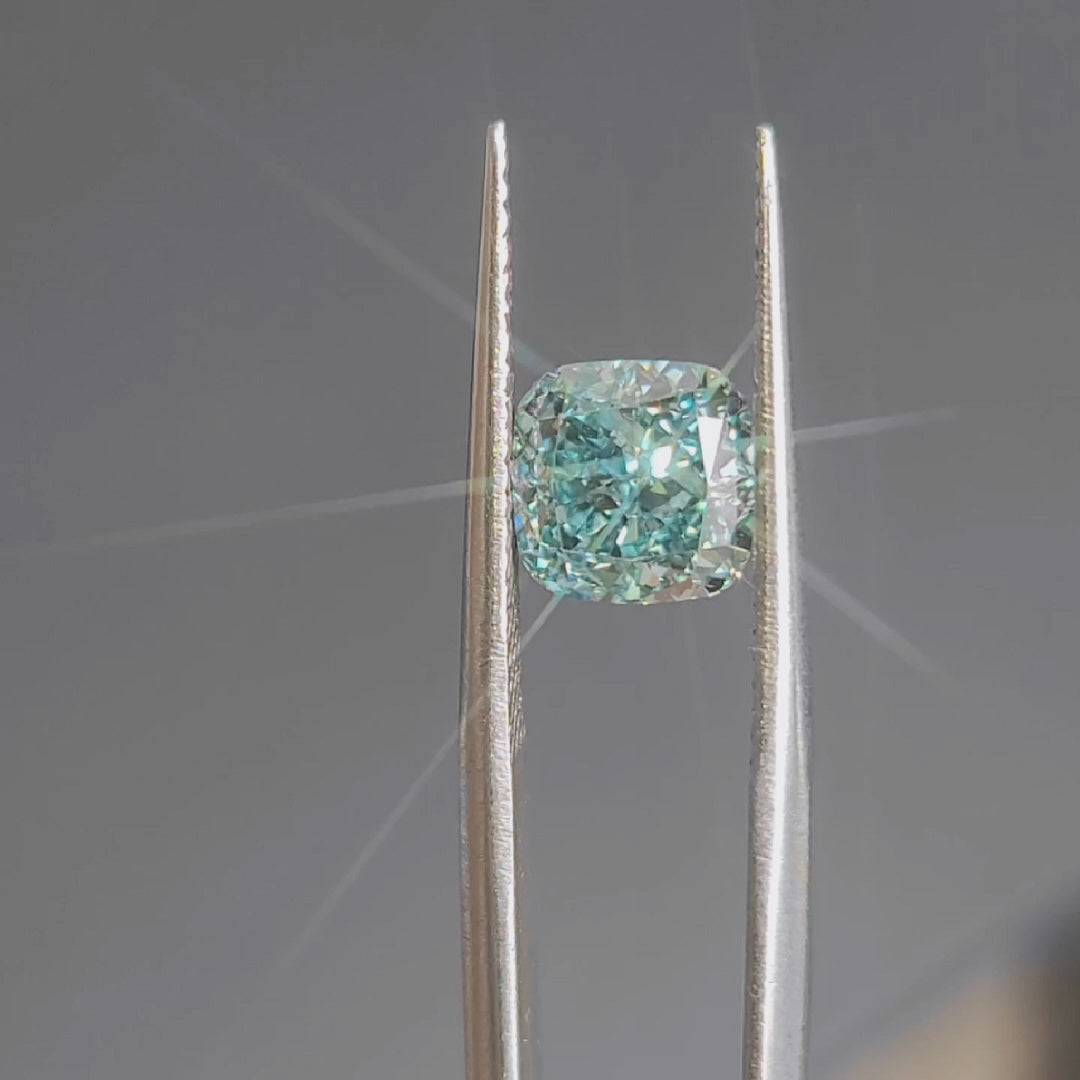 Sunlight video of 2.362ct cushion cut's brilliant blue sparkle and faceting