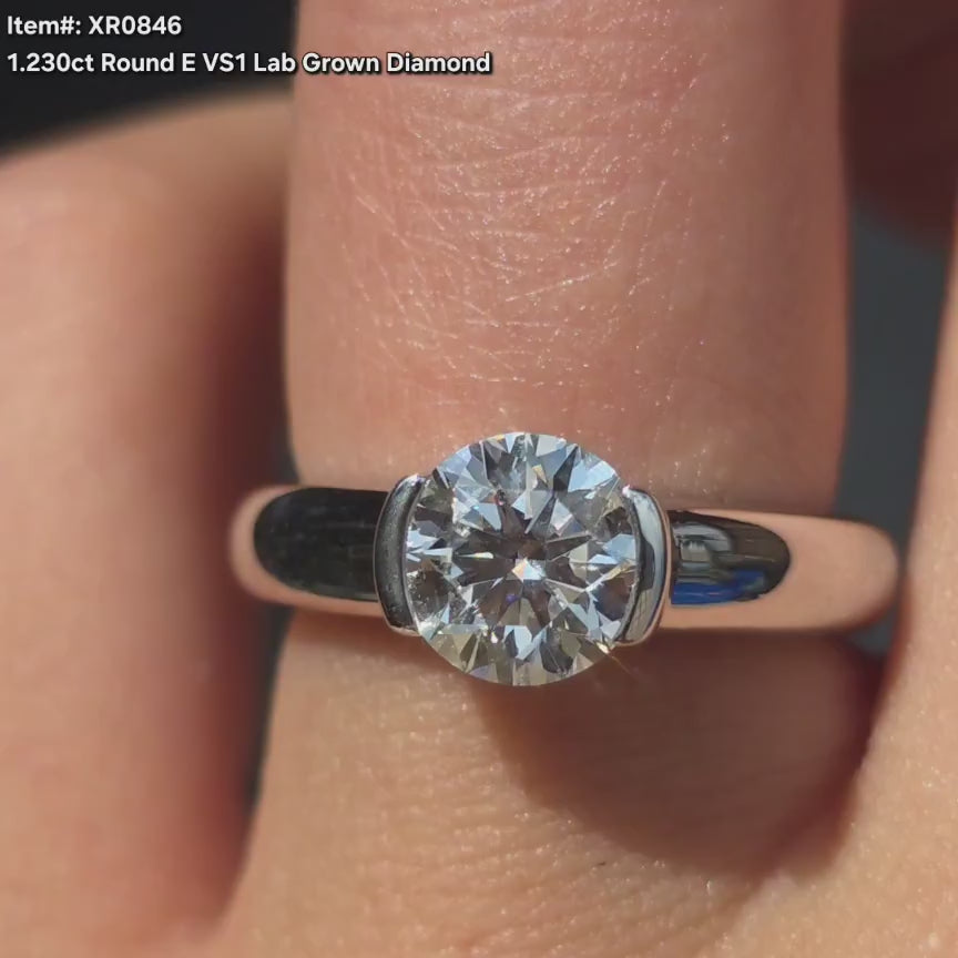 DovEggs round solitaire moissanite engagement ring video in sunlight