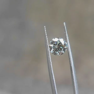 "1.53ct Old euro cut  round lab grown diamond with emerald-green flashes and antique faceting under sunlight video"