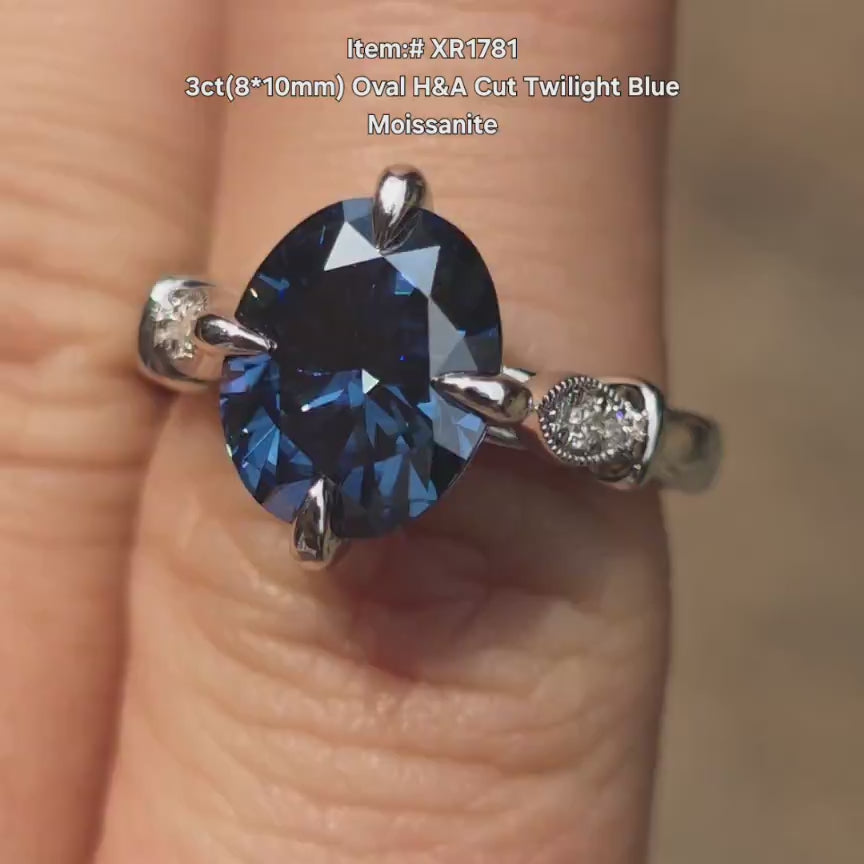 DovEggs oval twilight blue moissanite engagement ring in sunlight