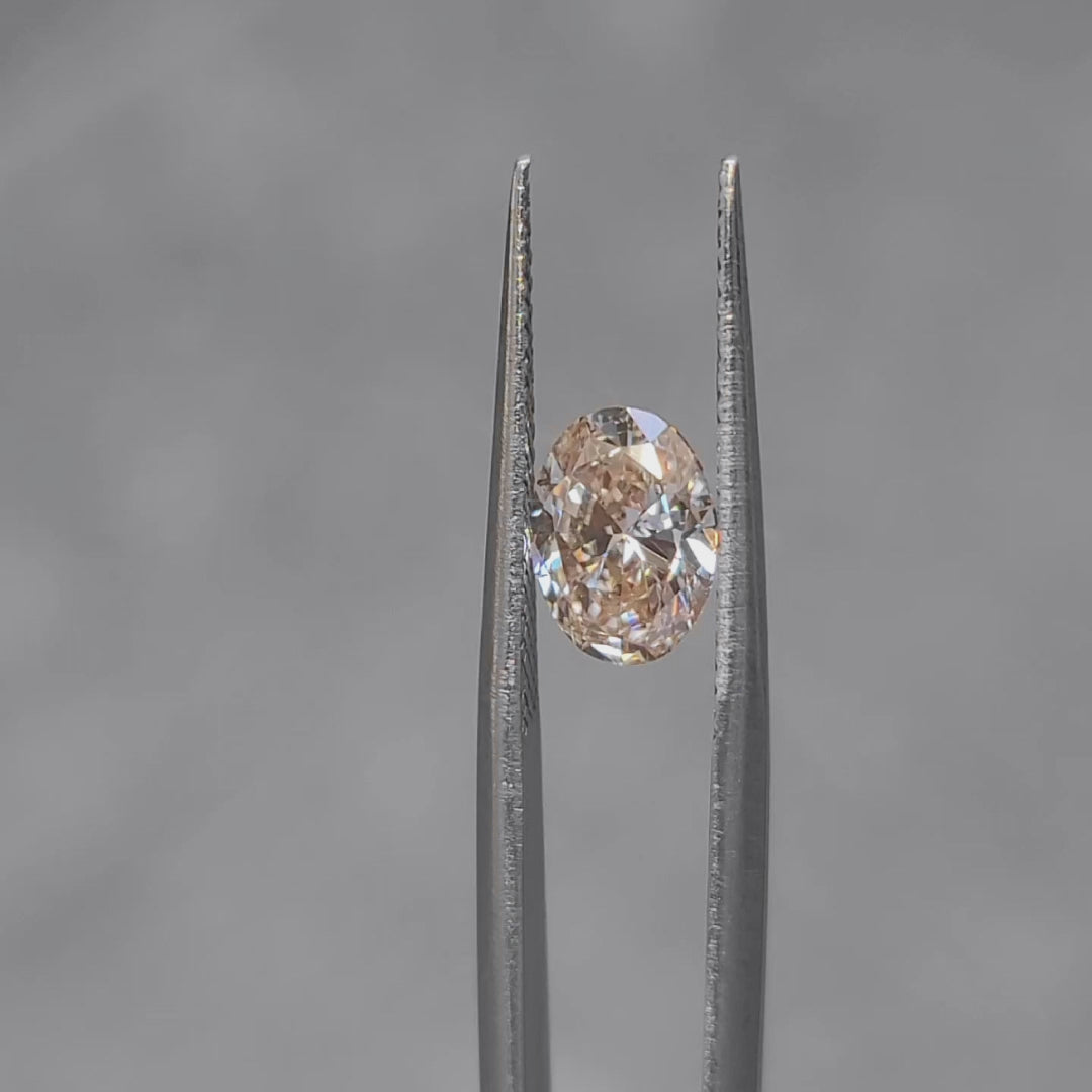 Outdoor video of 1.509ct oval Fancy Pink diamond's sparkle in sunlight