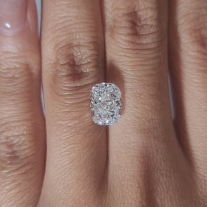 "Hand-modeled video of 2.751ct cushion diamond in warm indoor lighting"