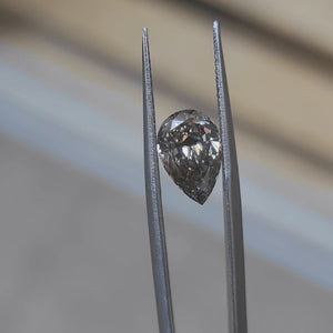 2.31ct pear fancy dark gray diamond in sunlight, showcasing unique color tones