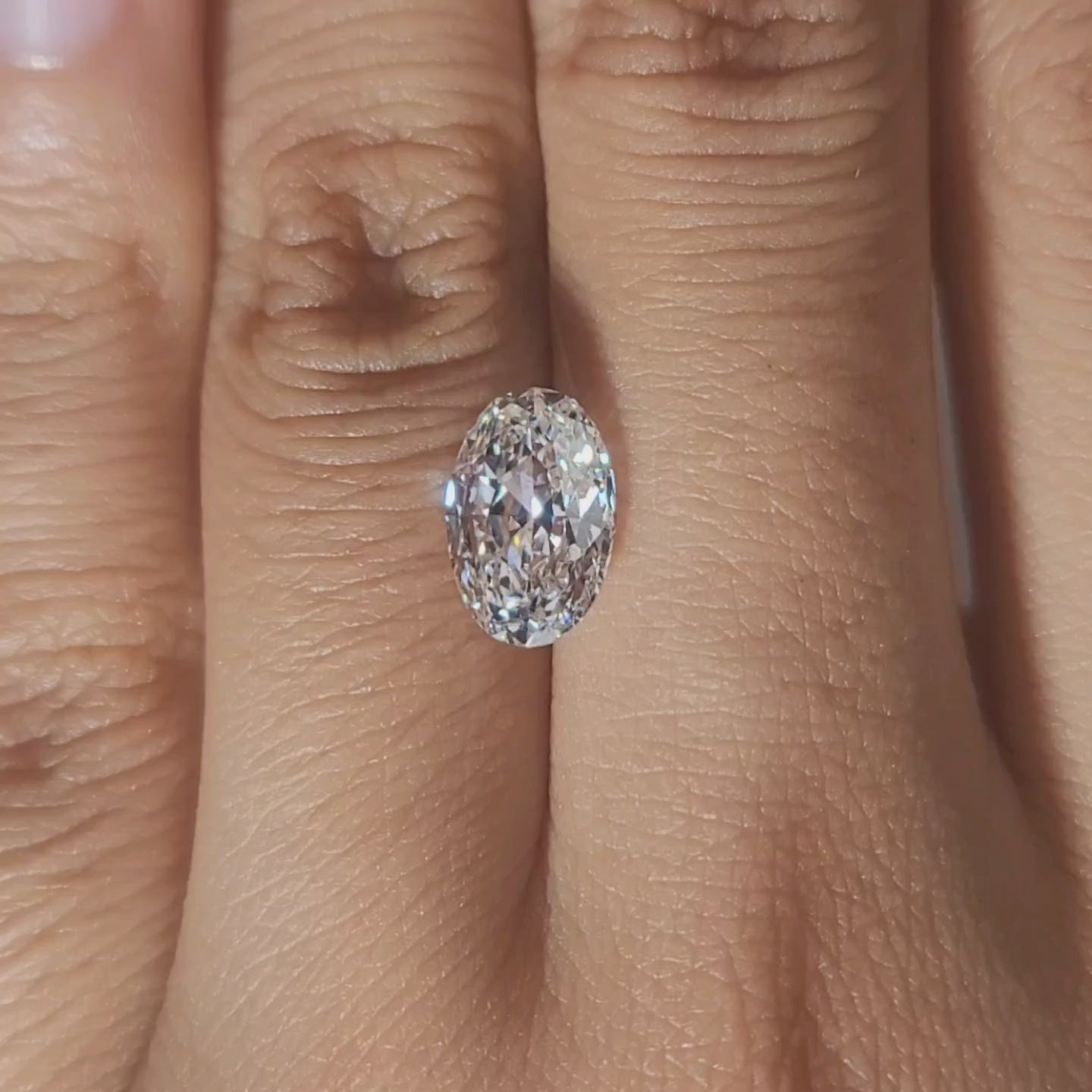 Close-up of 9.98mm rose cut's domed surface in warm light