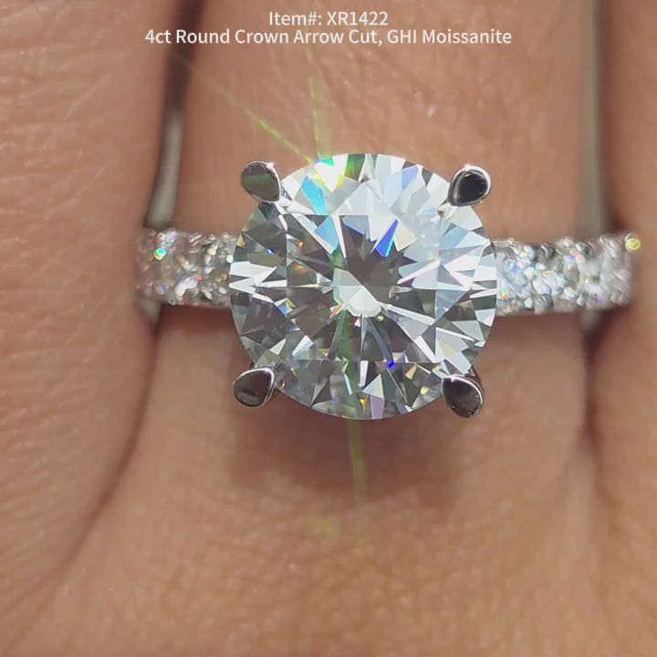 DovEggs Round Crown Arrow cut moissanite ring sparkling in sunlight video.