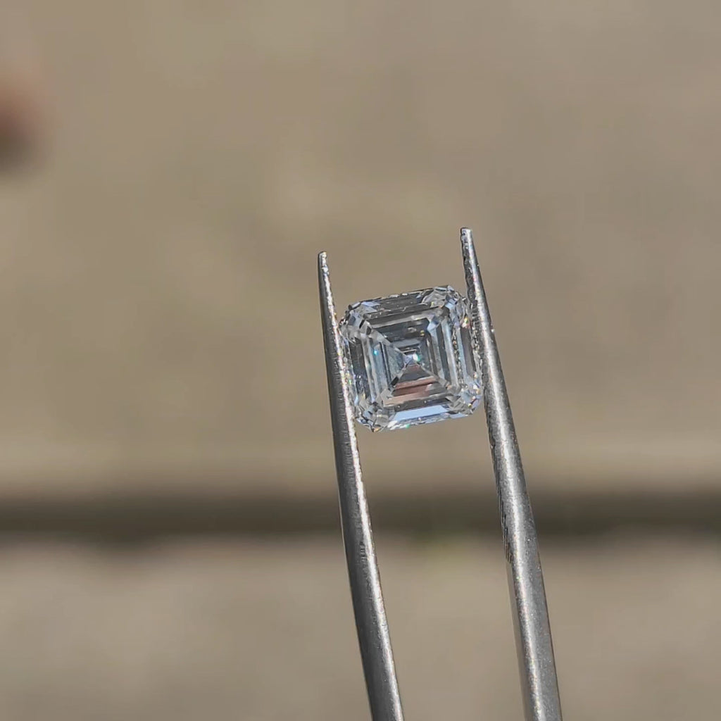 2.54ct Asscher lab diamond (D/VVS1) outdoors, displaying step-cut precision