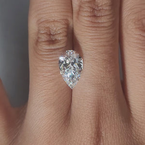 Finger-modeled video of 2.82ct pear diamond in ambient indoor light