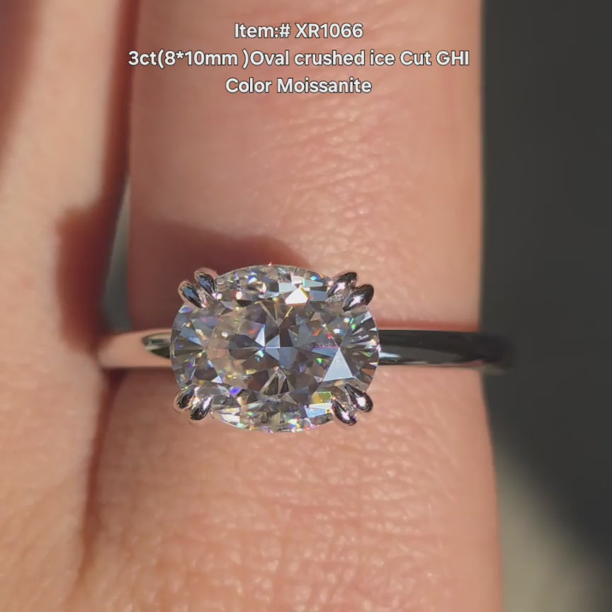 DovEggs Oval Crushed Ice cut moissanite ring sparkling in sunlight video.