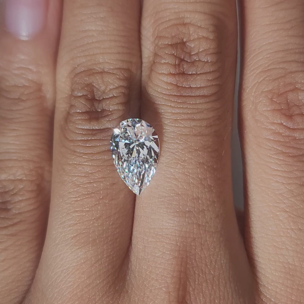 Finger-modeled video of 3.018ct pear diamond in ambient indoor light