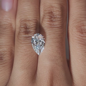 Finger-modeled video of 3.018ct pear diamond in ambient indoor light