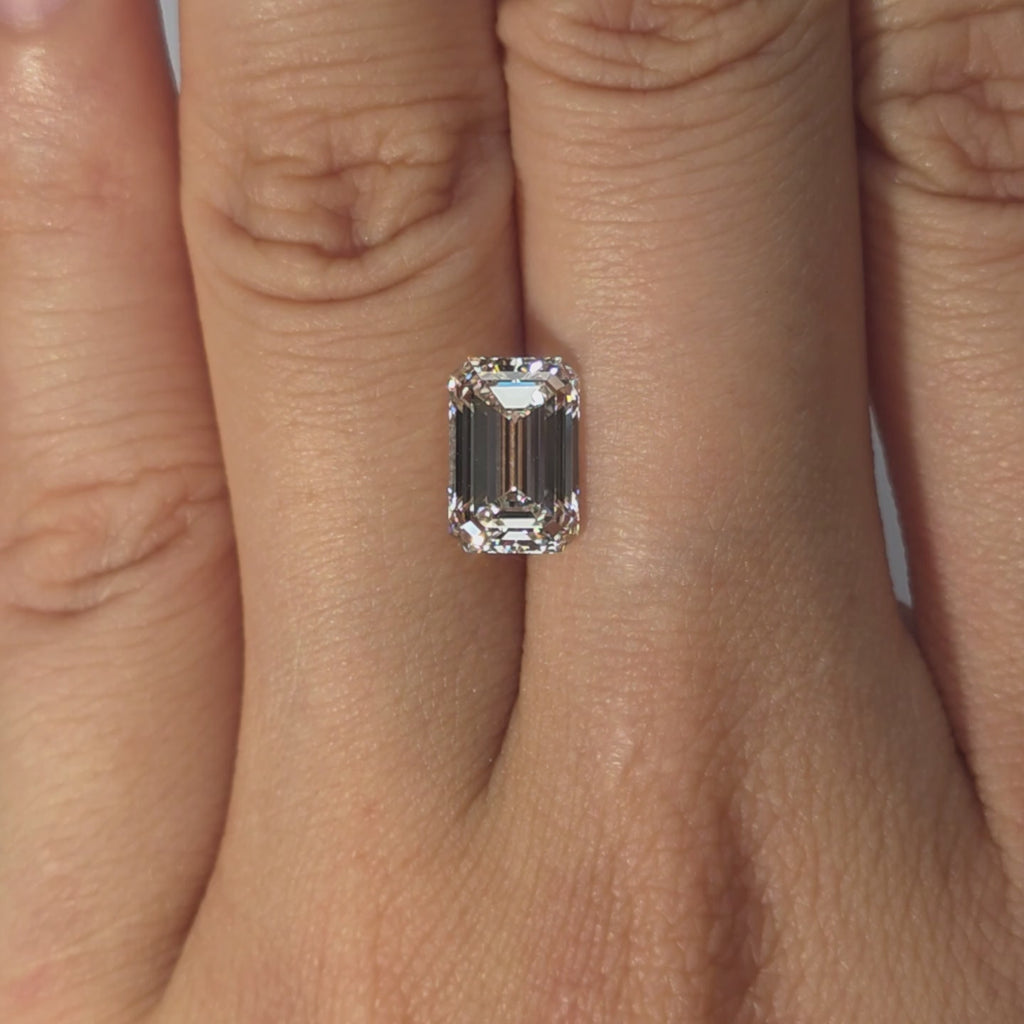 Lab diamond 2.58ct emerald cut F color VVS2 by DovEggs hand modeled in warm indoor light.