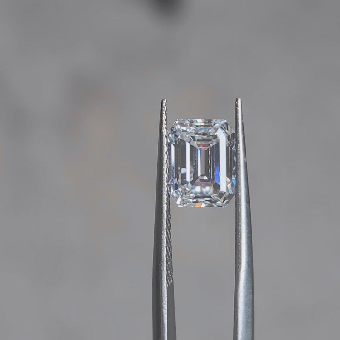 Sunlight video showcasing 3.124ct emerald cut's D color purity and step-cut brilliance