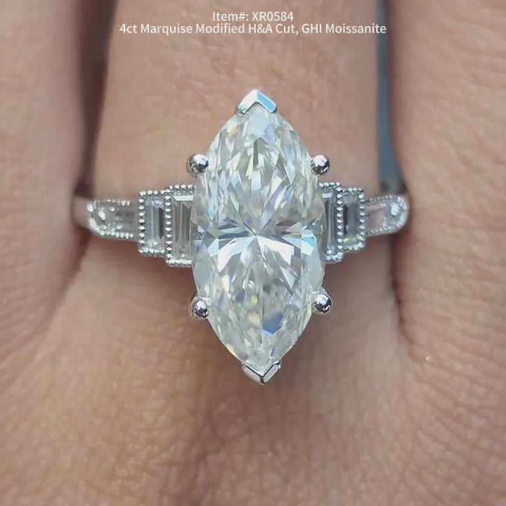 DovEggs GHI color Marquise Modified H&A cut moissanite ring sparkling in sunlight video.