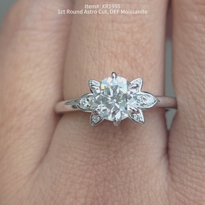 Round astro cut moissanite ring sparkling in sunlight video.
