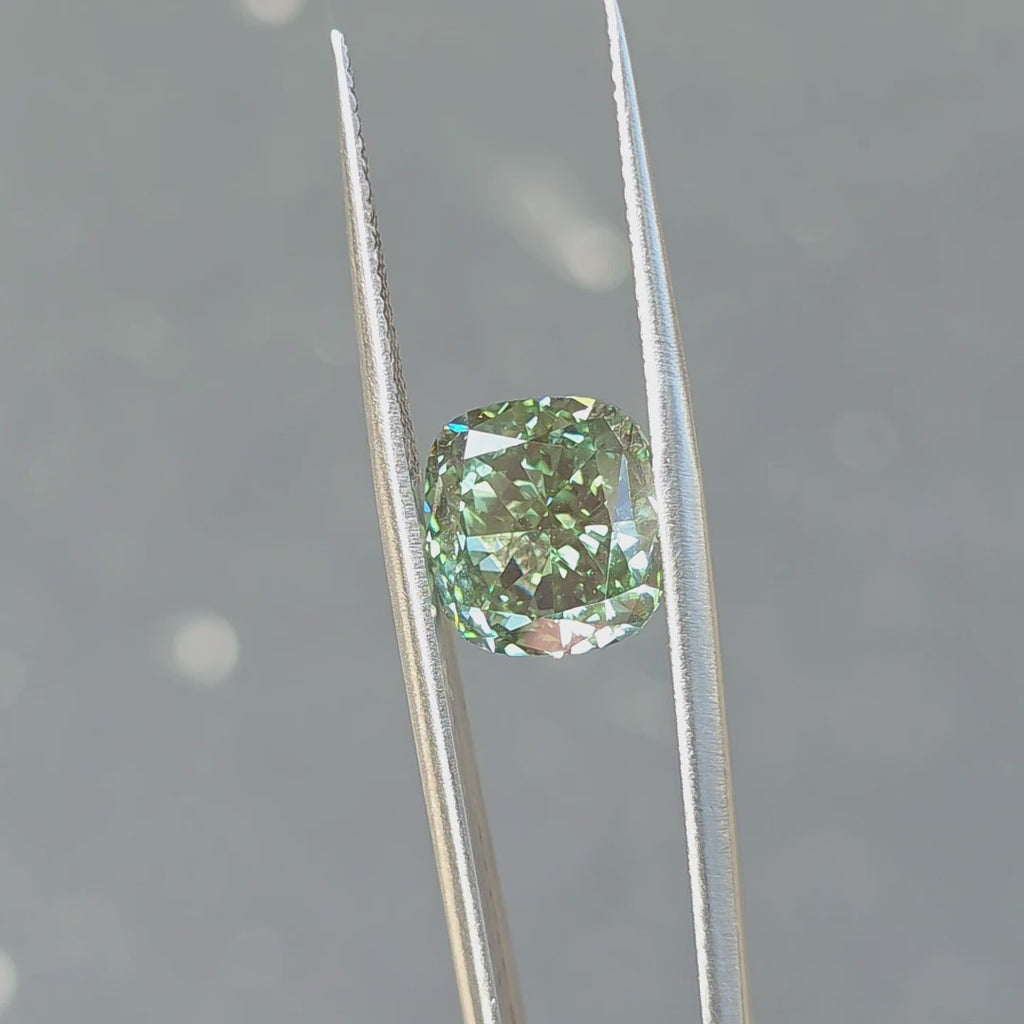 Sunlight reveals the intense green of a 7.18ct cushion brilliant cut fancy vivid green lab diamond.
