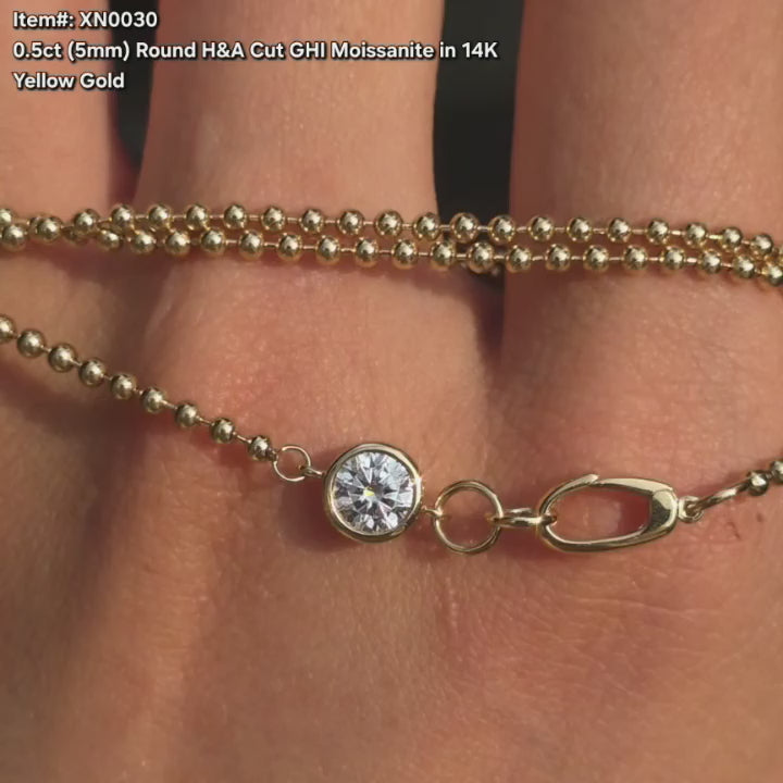  DovEggs round moissanite pendant necklace sparkling in sunlight video