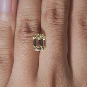 2.48ct Emerald yellow diamond in warm handheld lighting