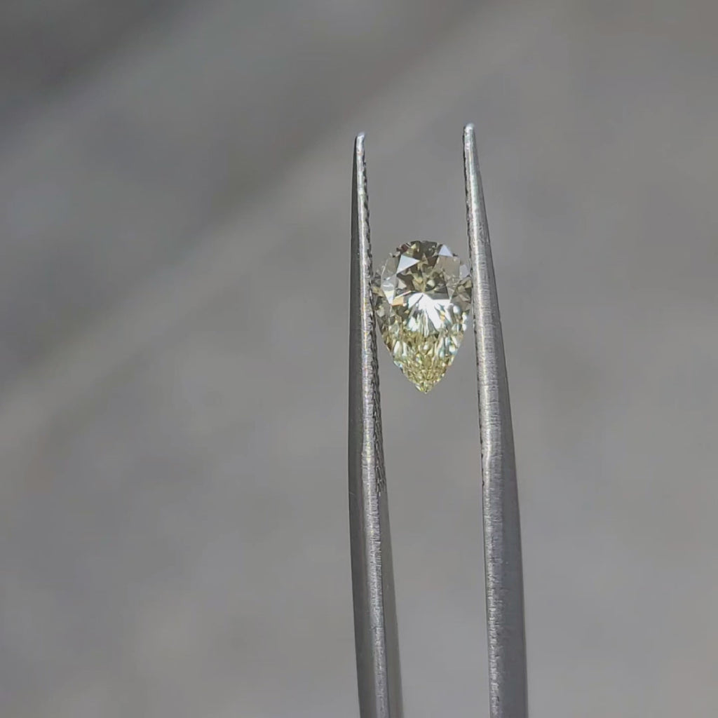 0.92ct pear shaped yellow diamond video showing teardrop shape in sunlight