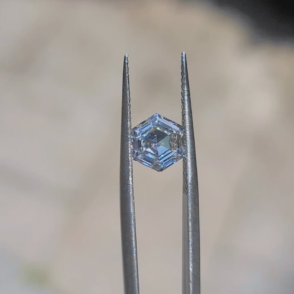 Sunlight video highlighting 2.137ct hexagon D color VVS2 diamond's brilliance