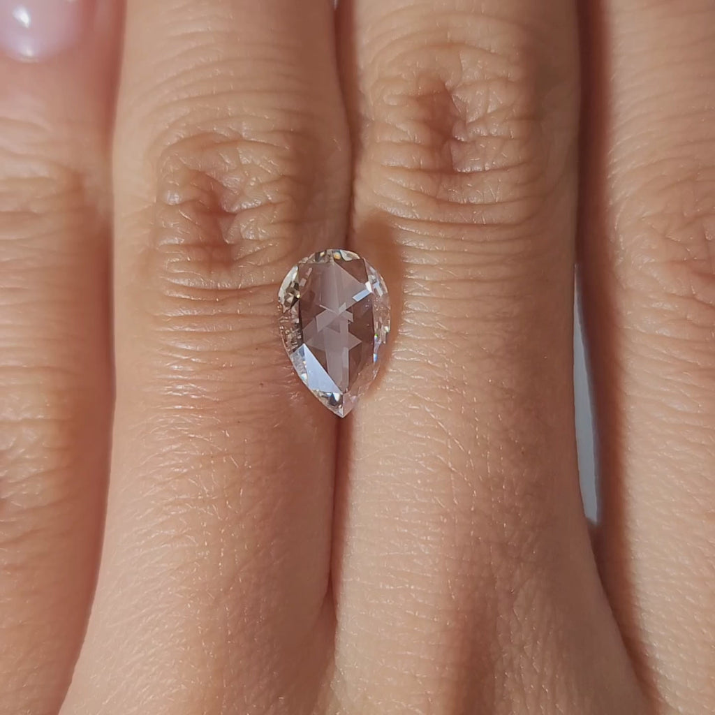 1.68ct Pear G color VS1 diamond in soft candlelight