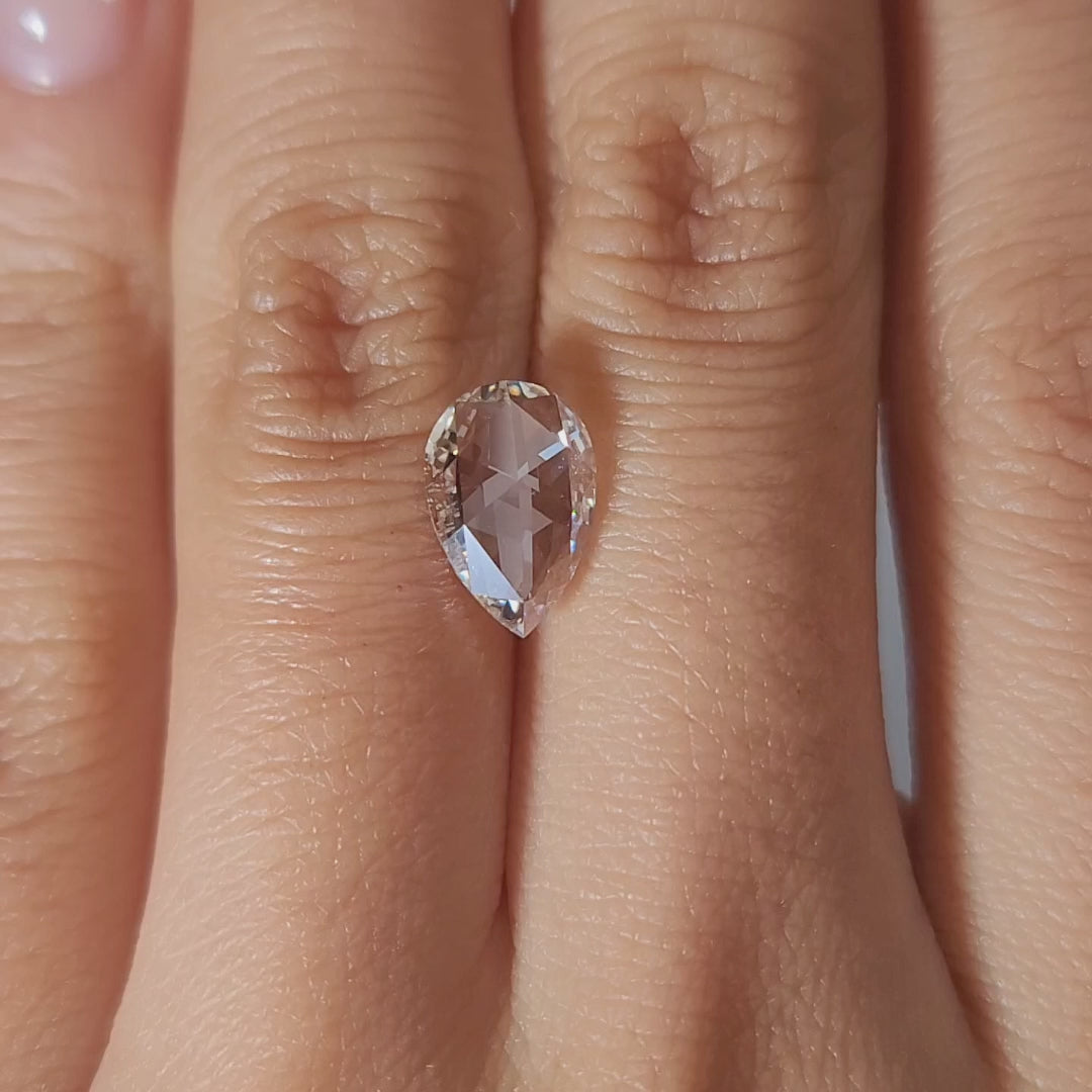 1.68ct Pear G color VS1 diamond in soft candlelight