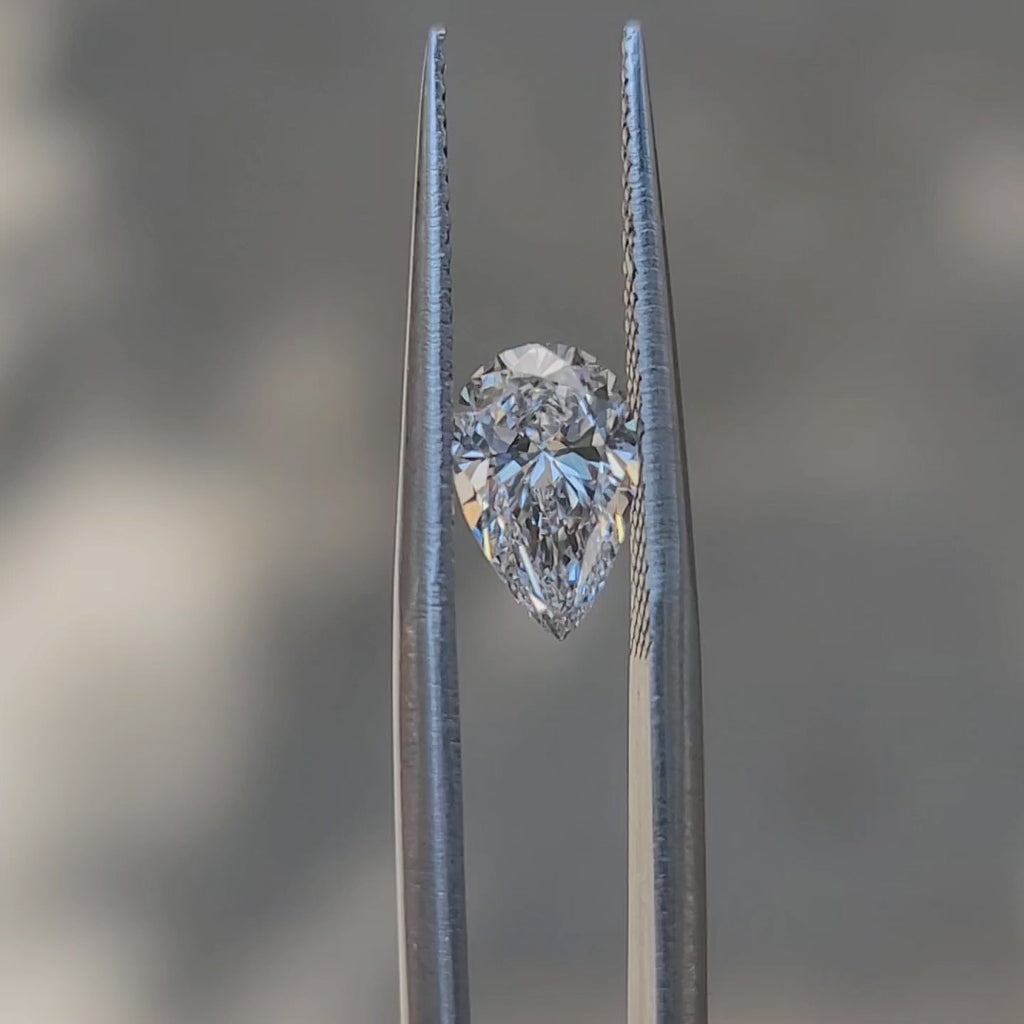 "Sunlight video showing 1.19ct pear cut diamond's D color fire"