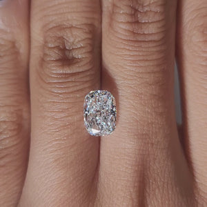 Close-up hand video of 2.015ct cushion diamond in soft indoor lighting