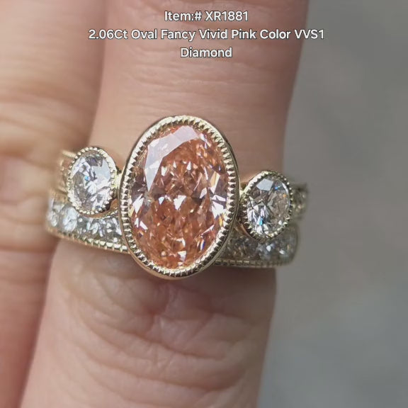 DovEggs 2.06ct Oval cut fancy pink lab diamond engagement ring sparkling in sunlight video.