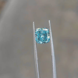 "Outdoor video of 2.18ct cushion cut's oceanic color shifts in sunlight"