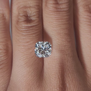 Hand-modeled video of 2.102ct cushion diamond in warm interior lighting