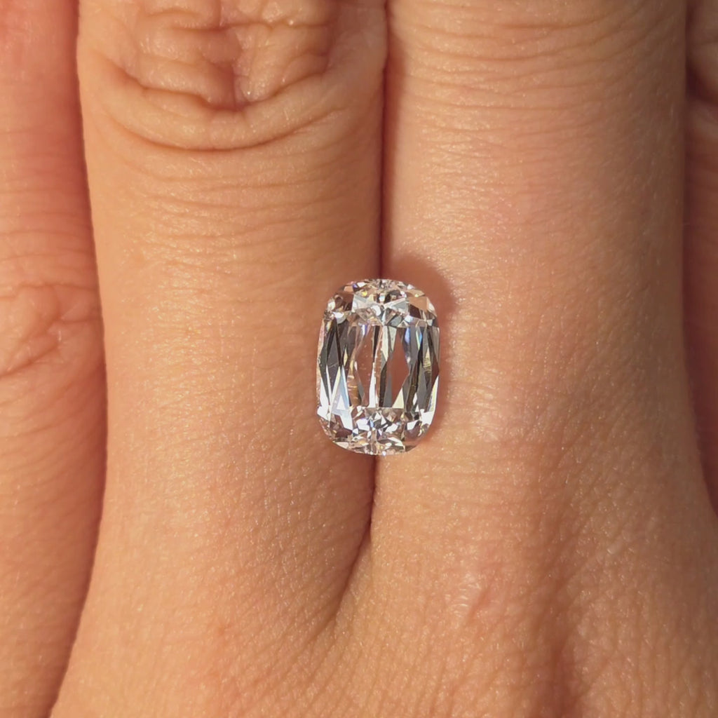 Lab diamond 2.51ct modified elongated cushion brilliant cut D color VS1 by DovEggs hand modeled in warm indoor light.