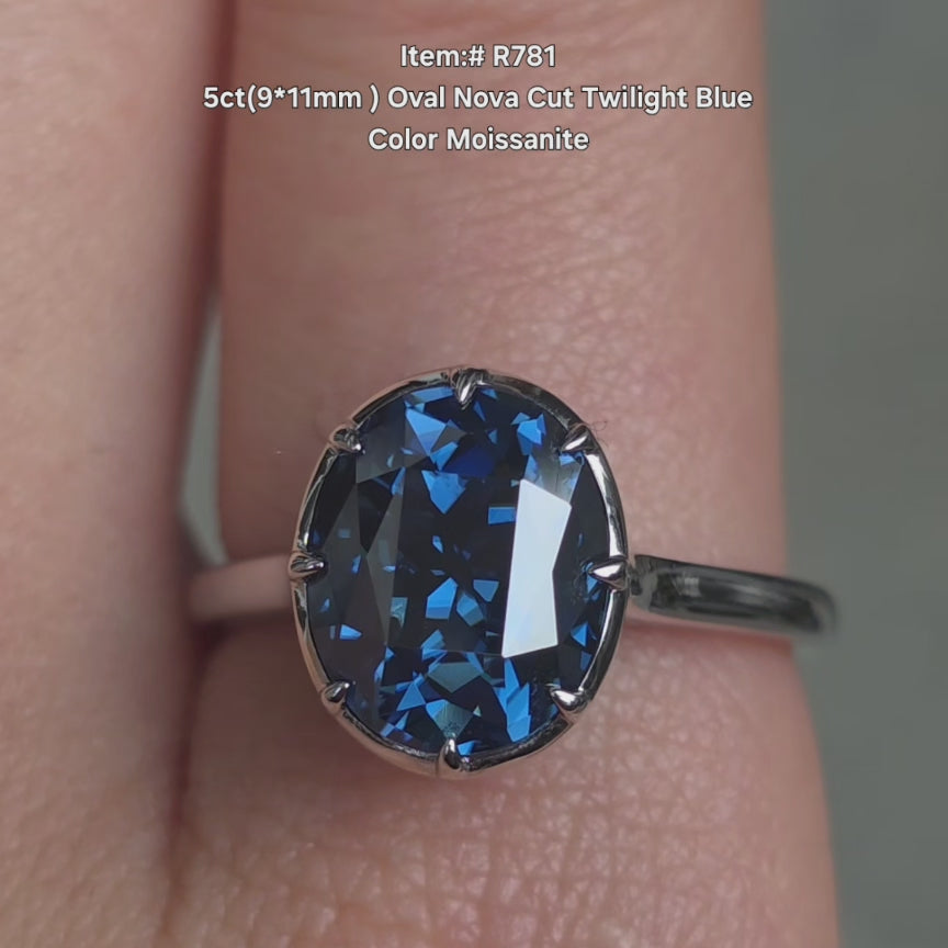 DovEggs Oval nova cut twilight blue color moissanite ring sparkling in sunlight video.