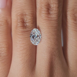 "Hand-modeled video of 1.59ct oval lab diamond in warm indoor lighting for elegance