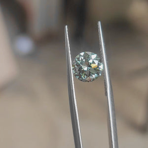 Outdoor video of 2.08ct old Euro cut round lab diamond with forest green color in natural light"