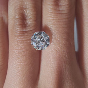 "Hand-modeled video of 2.165ct octagon diamond in warm indoor lighting"