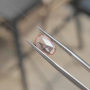 "Sunlight video highlighting 1.68ct oval rose cut's elongated pink sparkle"