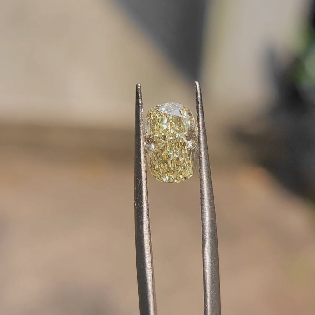 Golden hour video of 2.05ct cushion yellow diamond's fire