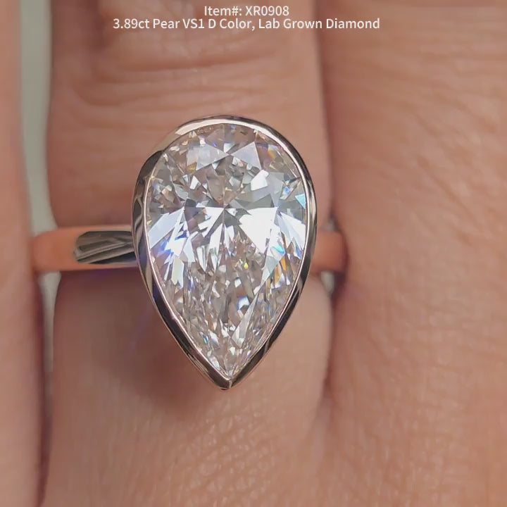 DovEggs pear lab diamond engagementr ring sparkling in sunlight video