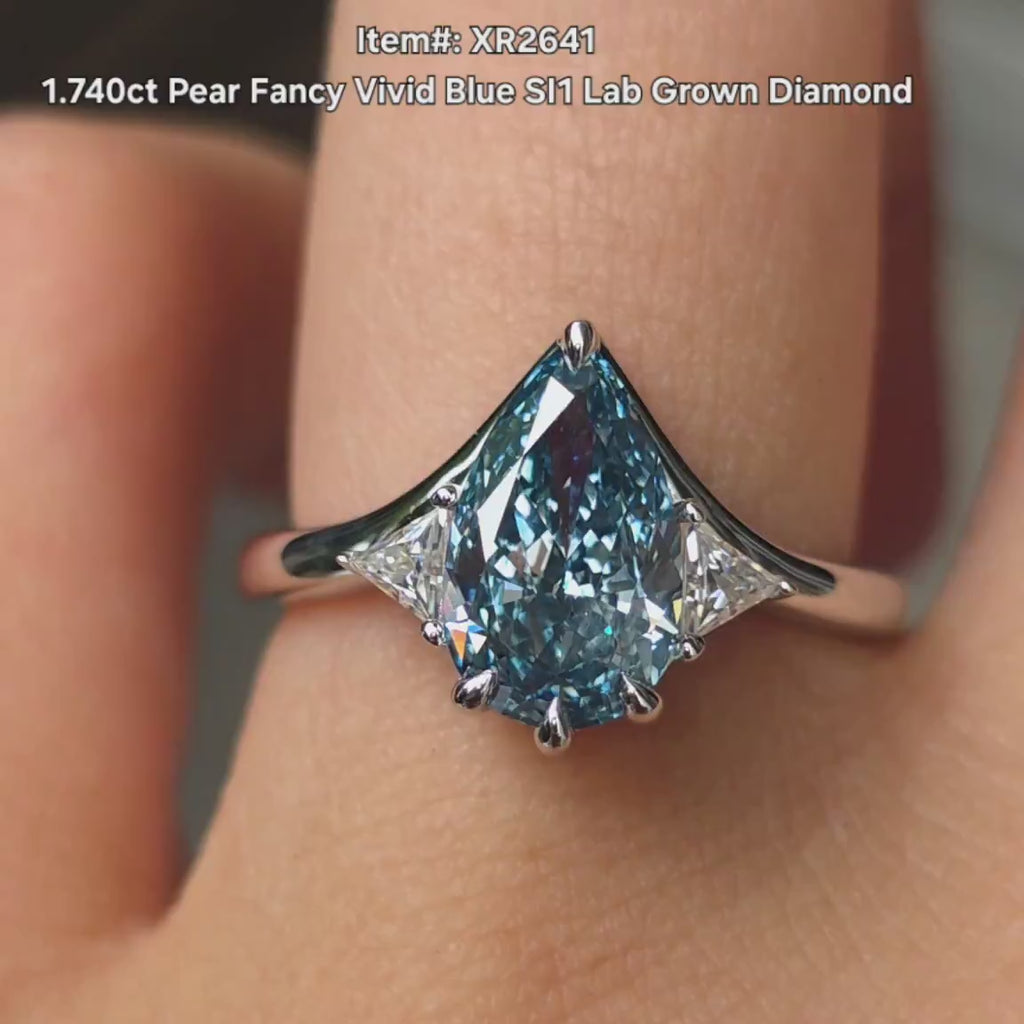 Pear three stones fancy vivid blue lab diamond engagement ring video