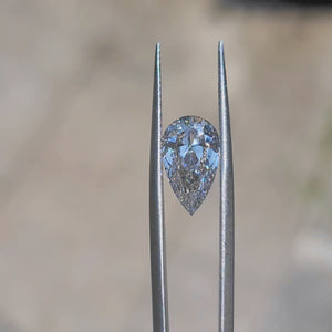 Outdoor video of 2.927ct pear F color VVS1 diamond's elegant sparkle