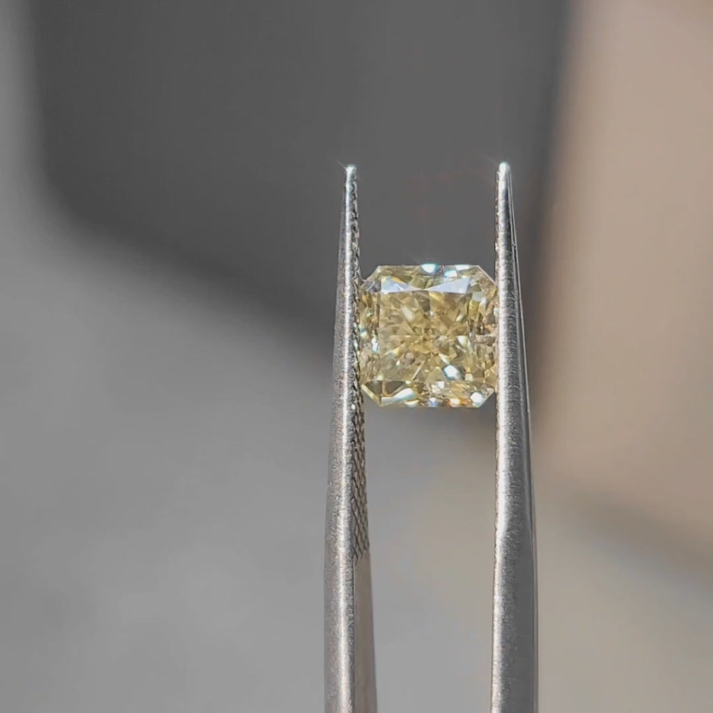 2.30ct radiant cut vivid yellow diamond's crushed ice effect in sun