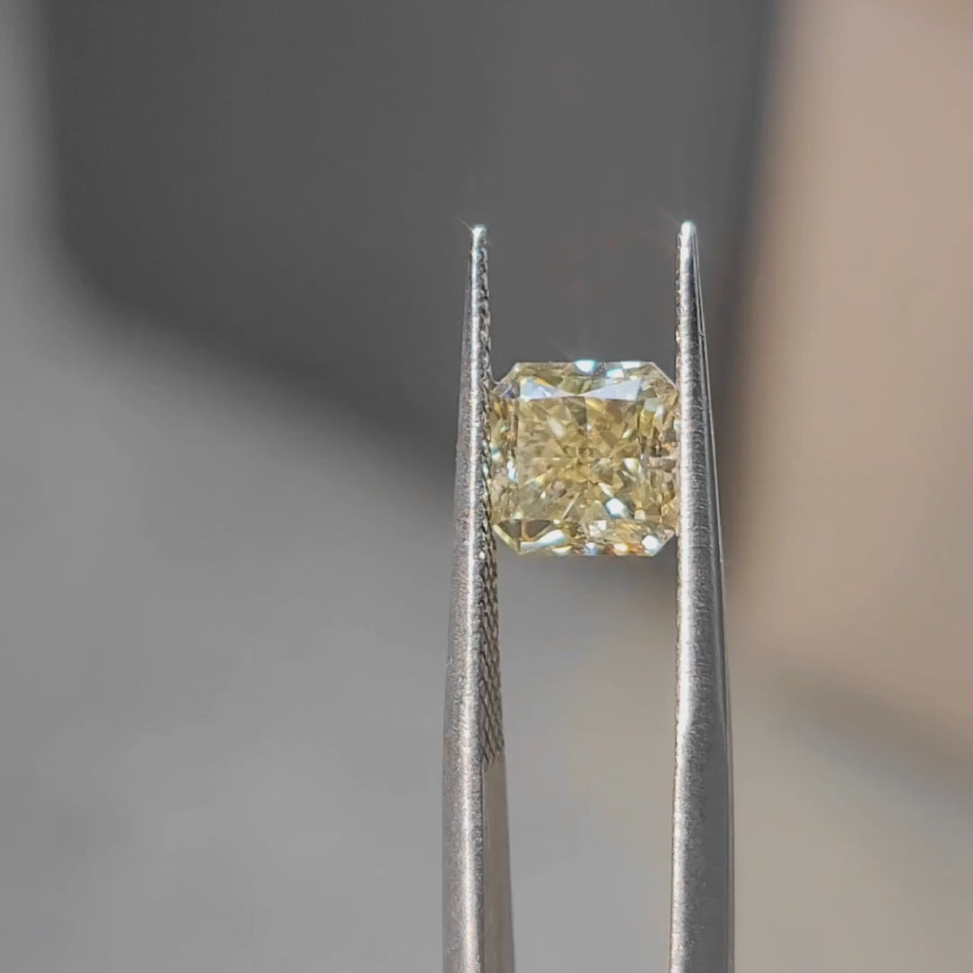 2.30ct radiant cut vivid yellow diamond's crushed ice effect in sun
