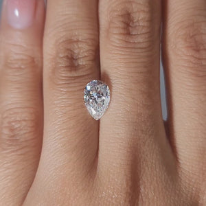 Hand modeling video showing pear diamond's size