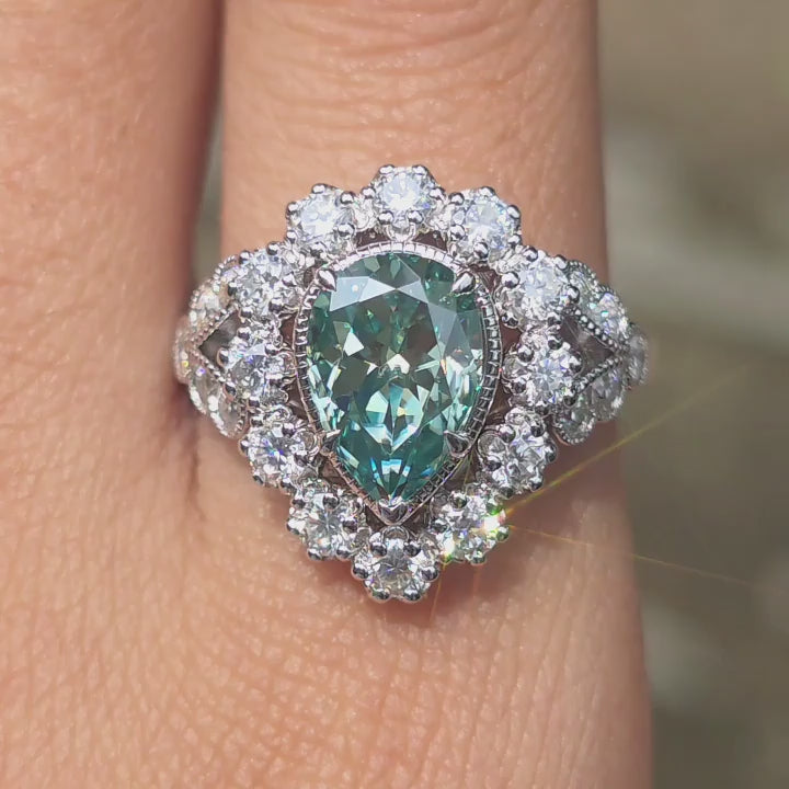  DovEggs Astro Pear peacock blue  moissanite ring sparkling in sunlight video